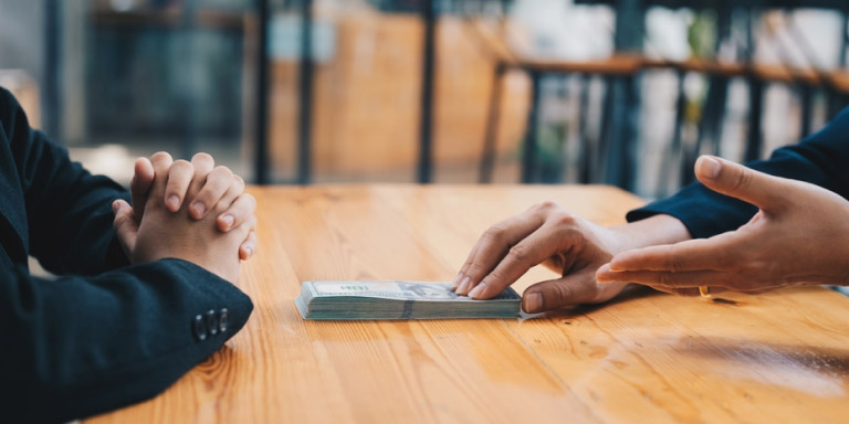 A business transaction between two parties with foreign currency used.